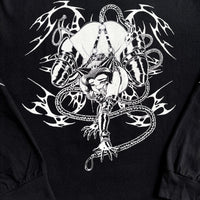 Close-up of rope-bound manga character and neo-tribal linework on black long sleeve shirt

