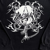 Close-up of rope-bound manga character and neo-tribal linework on black long sleeve shirt

