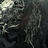 Close-up of sleeve with neo-tribal script and abstract linework on black fabric – INHUMANUM Sacrilege shirt