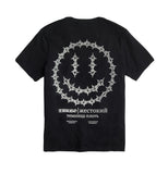 Back of INHUMANUM Dungeon Acid shirt – black short sleeve with chainlink smiley face and Russian text reading “The prison of flesh”